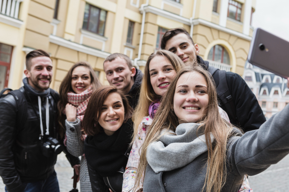 friends-taking-selfie-town-street